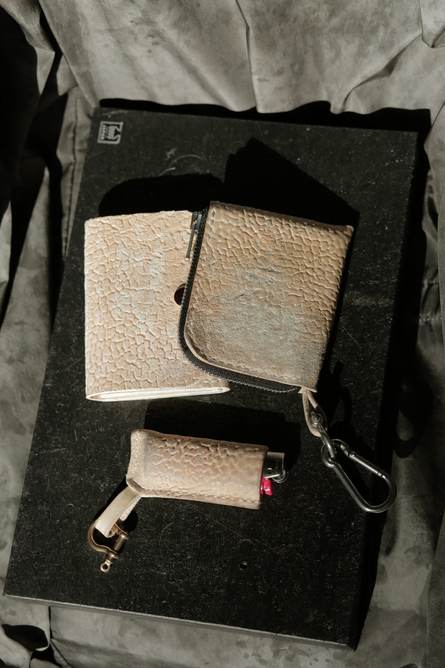 Hermann minimal snap wallet in dirty white horse culatta leather with copper snap and rivet details.