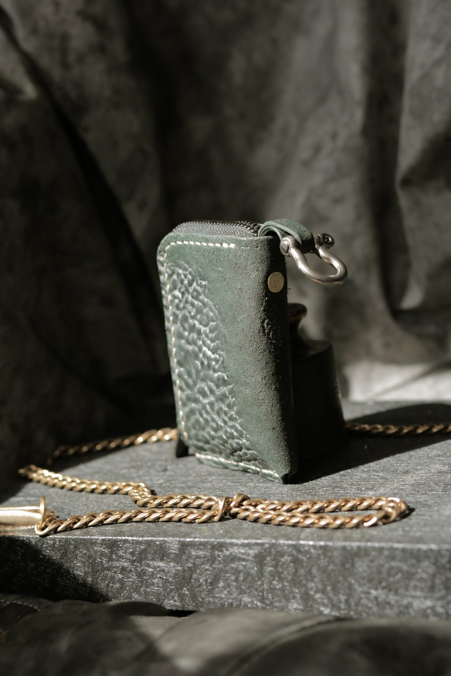 Herrfurth #002 dark green compact zip wallet with shell cordovan wrinkles and antique brass hardware.
