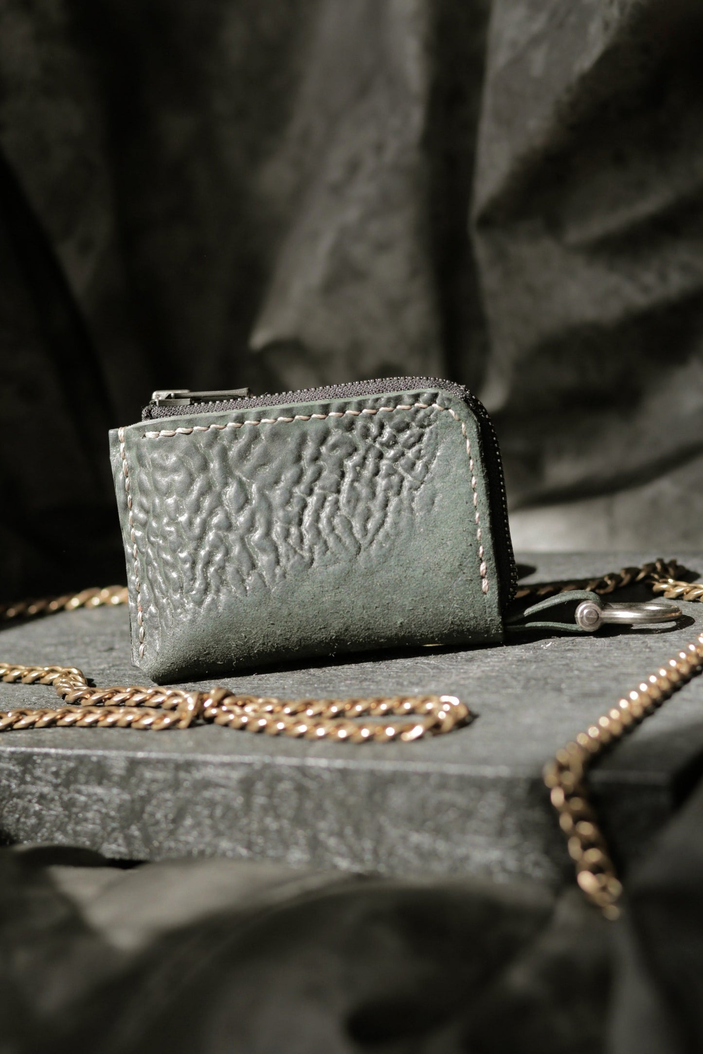 Herrfurth #002 dark green compact zip wallet with textured shell cordovan leather and antique brass hardware.