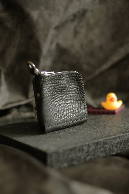 Boddin #007 compact handmade black wallet with unique textured veg tan reverse horse leather and zipper pouch.