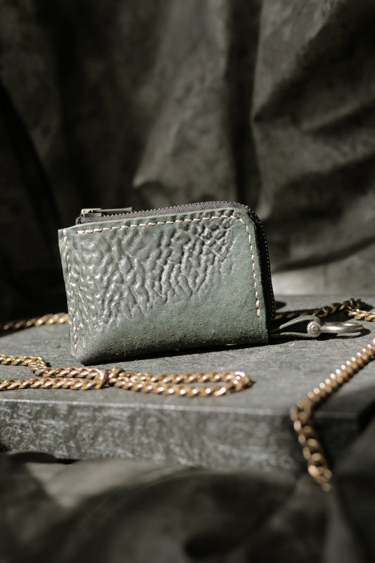 Herrfurth #002 dark green compact zip wallet with textured shell cordovan leather and antique brass hardware.