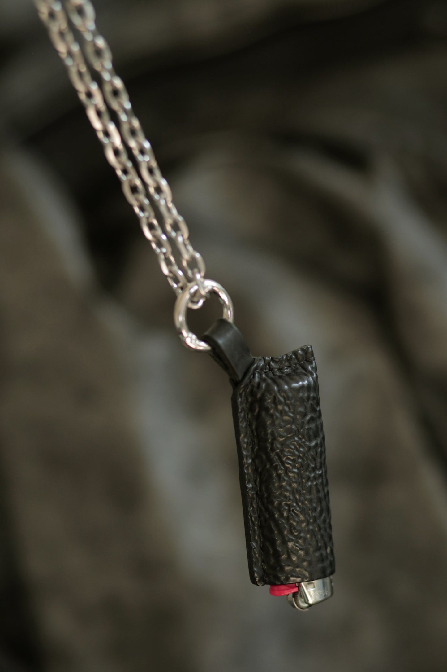 Lighter with black horse culatta leather case on silver chain, handmade durable and stylish design.